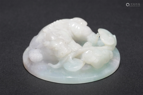 A CHINESE CARVED JADEITE PAPERWEIGHT