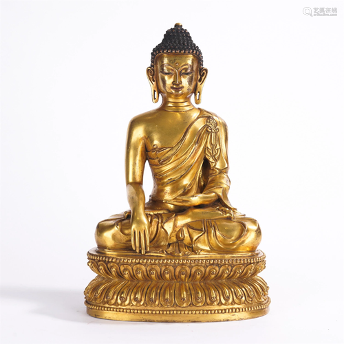 A TIBETAN GILT BRONZE FIGURE OF BHAIYAJYAGURU