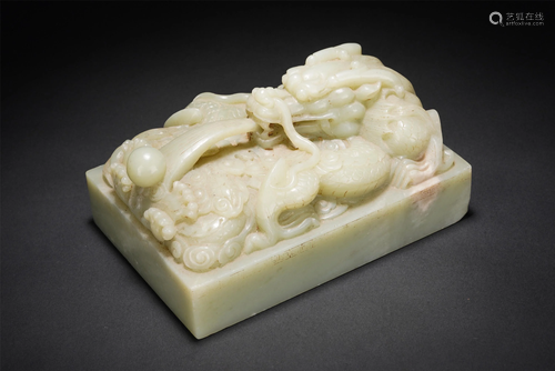 A CHINESE CARVED WHITE JADE DRAGON SEAL