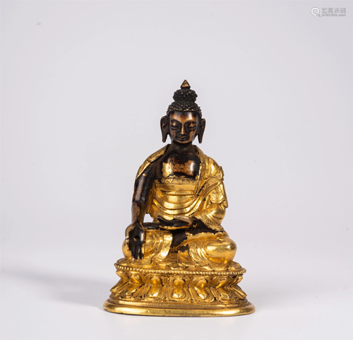 A GILT BRONZE FIGURE OF BHAIYAJYAGURU