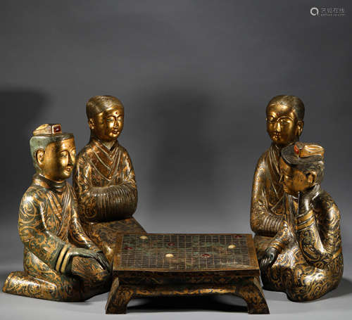 In the Tang Dynasty, bronze gilded chess players were servan...