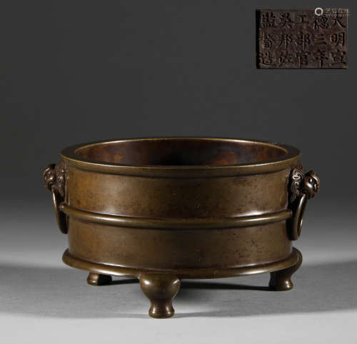 In the Ming Dynasty, a bronze censer with two animal ears an...
