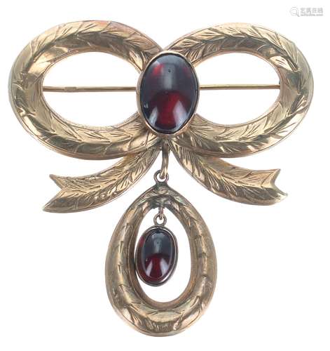 9ct engraved bow style brooch set with two cabochon garnets,...