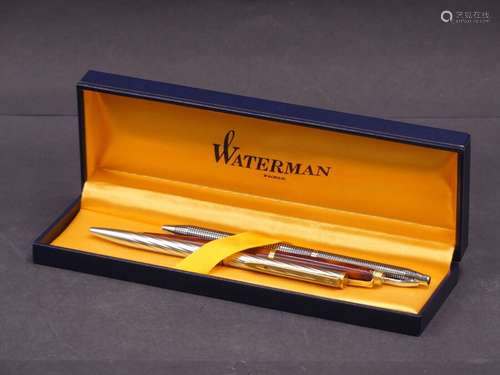 WATERMAN. Ensemble de trois stylos. Deux en métal et un à im...