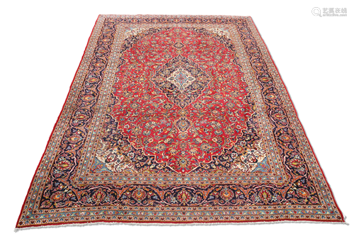 A KASHAN CARPET, CIRCA 1970. 405cm by 305cm