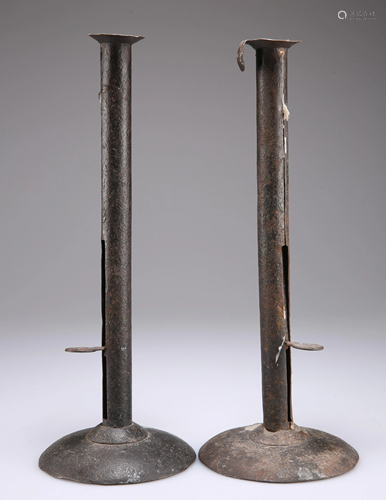 A PAIR OF EARLY 19TH CENTURY SHEET IRON CANDLESTICKS,