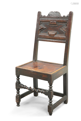 A 17TH CENTURY OAK PANEL-BACK CHAIR, with boarded seat