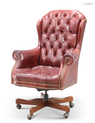 AN OXBLOOD LEATHER DEEP-BUTTONED SWIVEL DESK CHAIR,