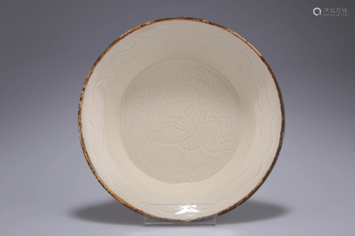 A CHINESE DING WARE DISH, circular with everted broad