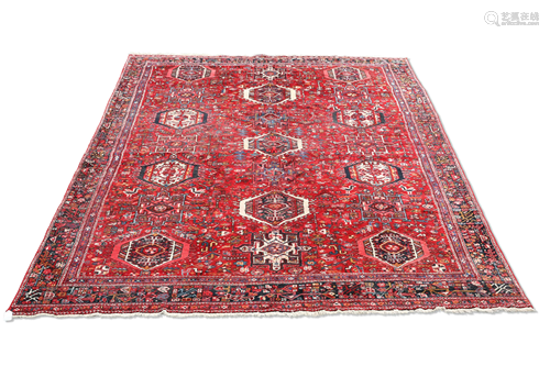 A PERSIAN HERIZ CARPET. 373cm by 260cm