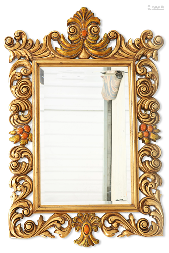 A LARGE BAROQUE STYLE GILT COMPOSITION MIRROR, the