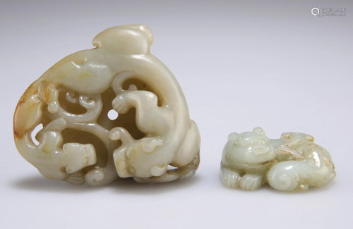 TWO CHINESE JADE CARVINGS, the first a disc depicting a