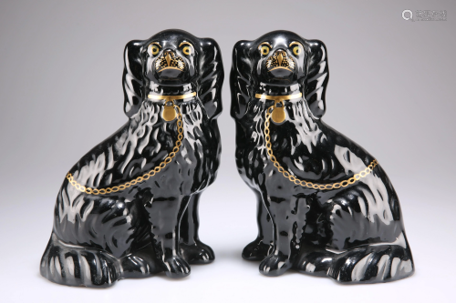 A PAIR OF VICTORIAN STAFFORDSHIRE MODELS OF SEATED