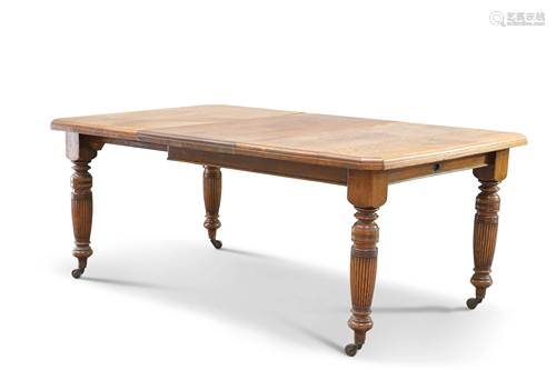 A VICTORIAN OAK WIND-OUT EXTENDING DINING TABLE, the