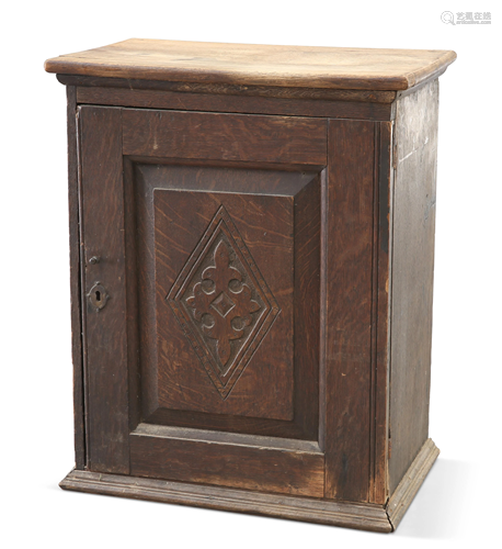 AN 18TH CENTURY OAK SPICE CUPBOARD, with lozenge-carved