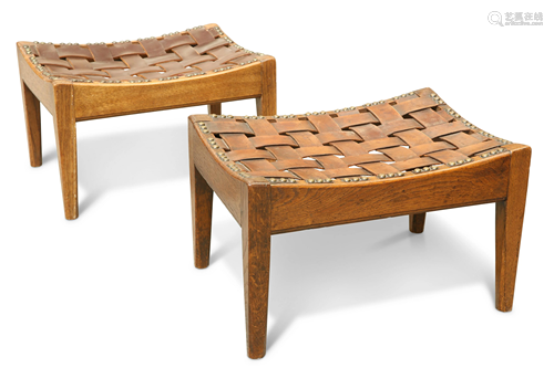 A PAIR OF ARTS AND CRAFTS OAK AND LEATHER STOOLS, BY