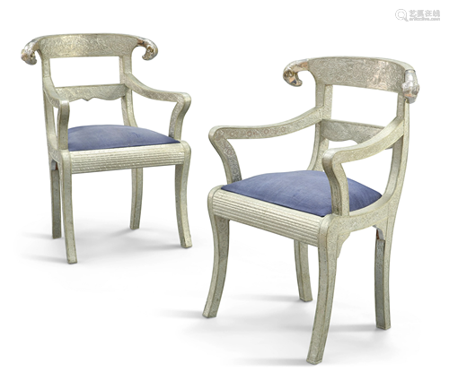 A PAIR OF SILVERED METAL ARMCHAIRS IN THE ANGLO-INDIAN