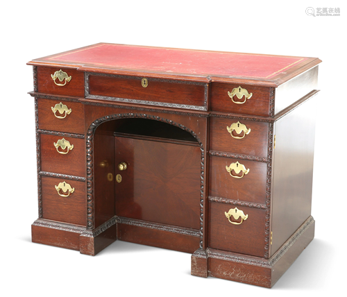 A LIMITED EDITION MAHOGANY KNEEHOLE DESK, in th…