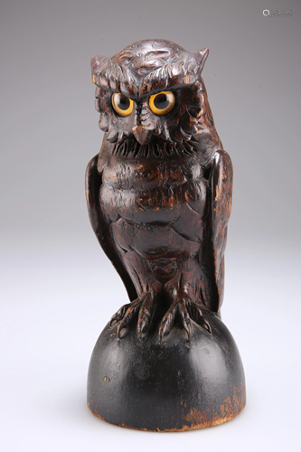 A BLACK FOREST CARVED AND STAINED SOFTWOOD MODEL OF AN