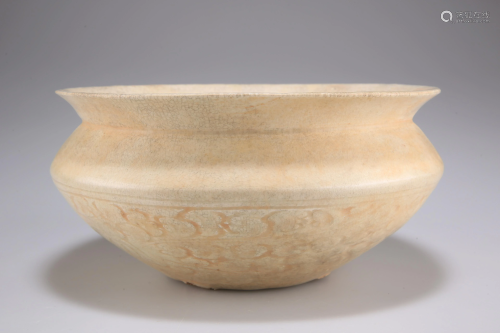 A CHINESE DING WARE BOWL, squat circular with
