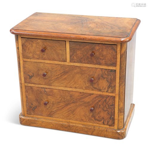 A VICTORIAN WALNUT MINIATURE CHEST OF DRAWERS, the