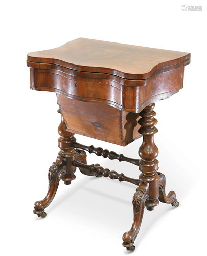 A VICTORIAN WALNUT GAMING AND SEWING TABLE, the