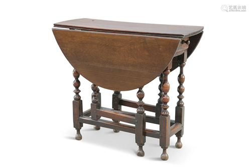 A SMALL 18TH CENTURY OAK GATELEG TABLE, the oval top