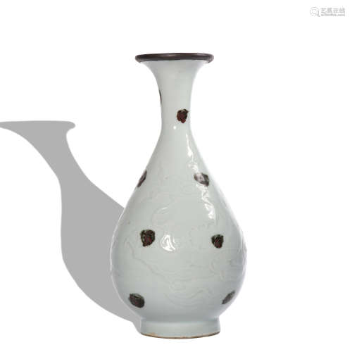 A white glazed 'dragon' pear-shaped vase