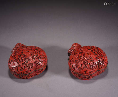 A pair of carved lacquerware box