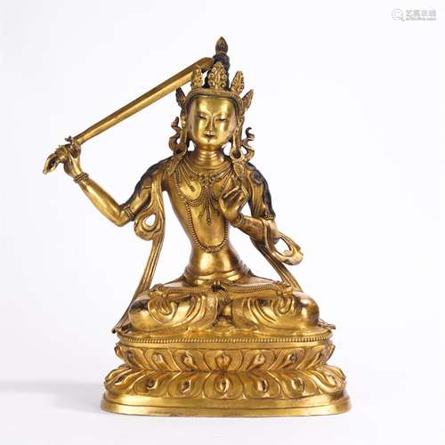 A TIBETAN GILT-BRONZE FIGURE OF MANJSRI