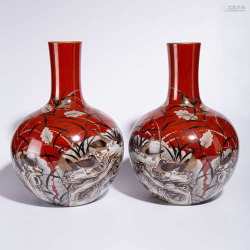 A pair of Qing Qianlong pastel celestial bottles