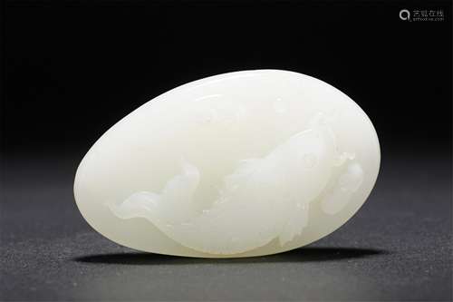 A CHINESE CARVED WHITE JADE FISH PENDANT