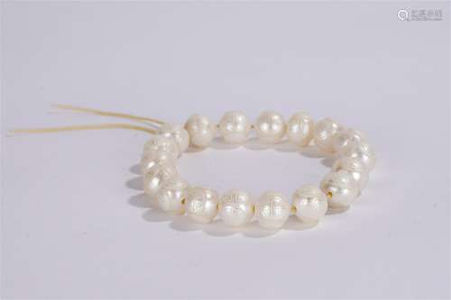 A CHINESE INCISED 'SHOU' CHARACTERS PEARL PRAYER BEADS