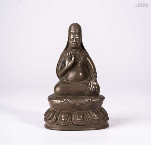 A TIBETAN SILVER SEATED SAKYA LAMA