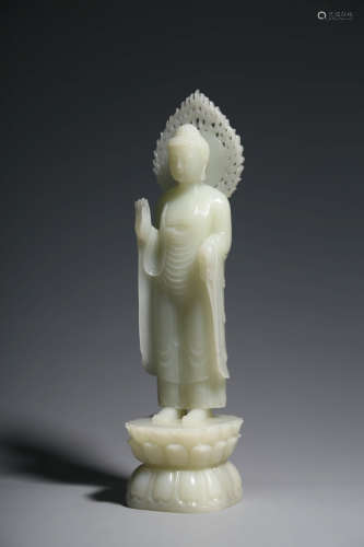 CHINESE CARVED WHITE JADE FIGURE OF SHAKYAMUNI