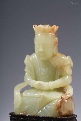 CHINESE CARVED RUSSET JADE FIGURE OF KSITI GARBHA