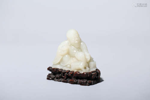 CHINESE CARVED WHITE JADE FIGURE OF ARHAT