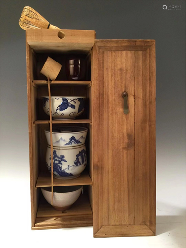 A SET OF BLUE AND WHITE TEA WARES AND WOODEN CABINET