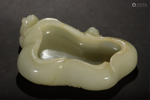 A CARVED LOTUS AND FROGS WHITE JADE WASHER