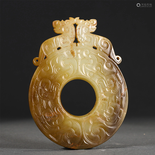 A CHINESE CARVED JADE BI