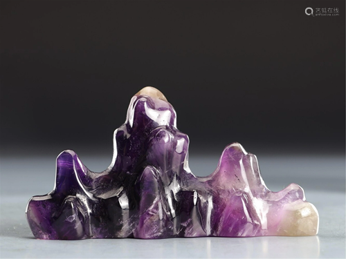 A MOUNTAIN SHAPED PURPLE CRYSTAL BRUSH REST