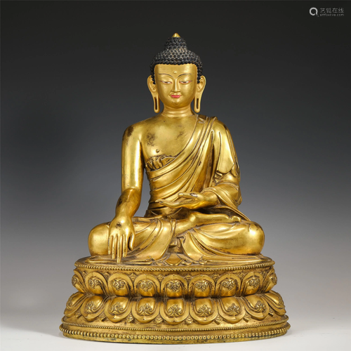 A CHINESE GILT BRONZE SAKYAMUNI