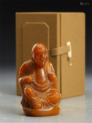 A SOAPSTONE CARVED FIGURINE OF ARHAT