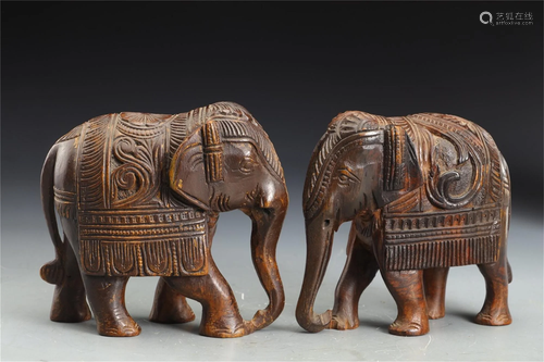 PAIR OF CARVED HARDWOOD ELEPHANT DECORATIONS