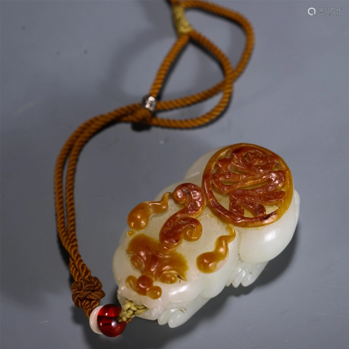 A CHINESE JADE CARVED BEAST PENDANT
