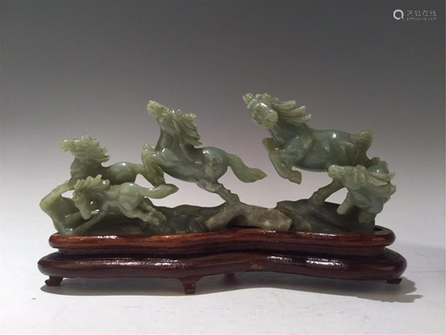 A CELADON JADE CARVING OF HORSES