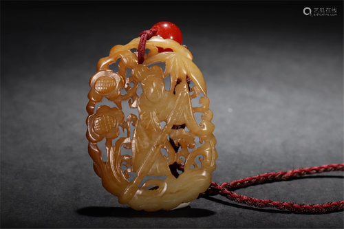 A HOLLOW CARVED YELLOW JADE FIGURAL PENDANT