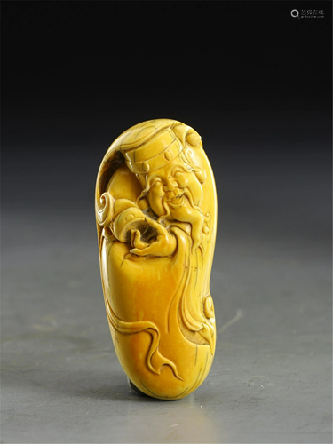 A CARVED FIGURAL HAND PIECE