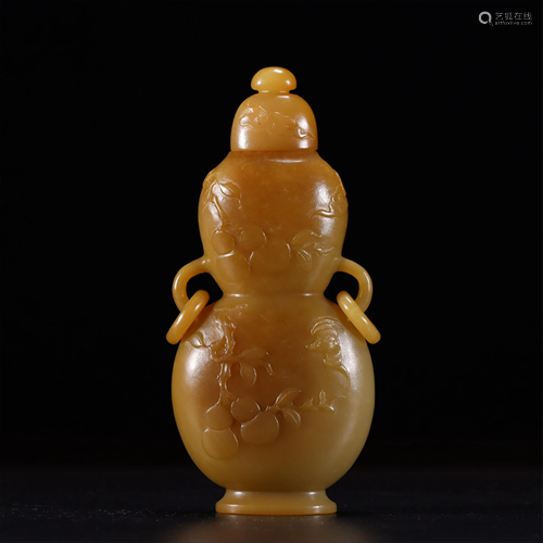 A CARVED YELLOW JADE DOUBLE-GOURDS VASE AND COVER