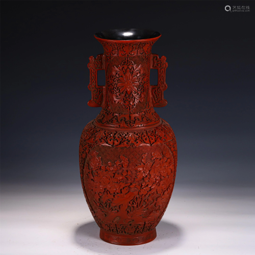 A CHINESE CARVED RED LACQUER DOUBLE-HANDLED VASE
